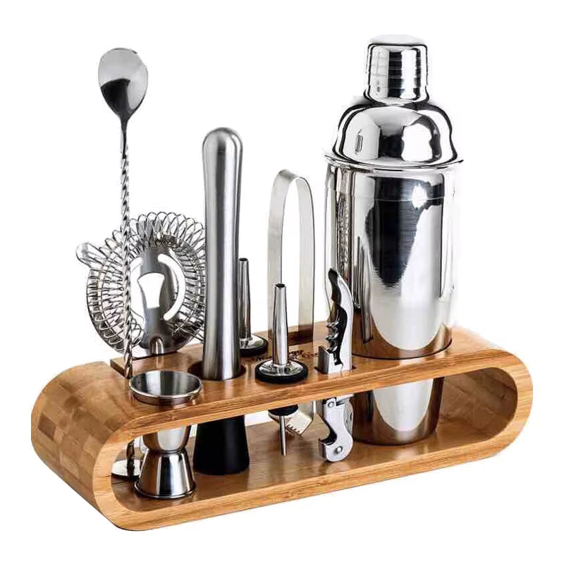 Stainless steel bartender cocktail shaker set with tools on wooden stand.