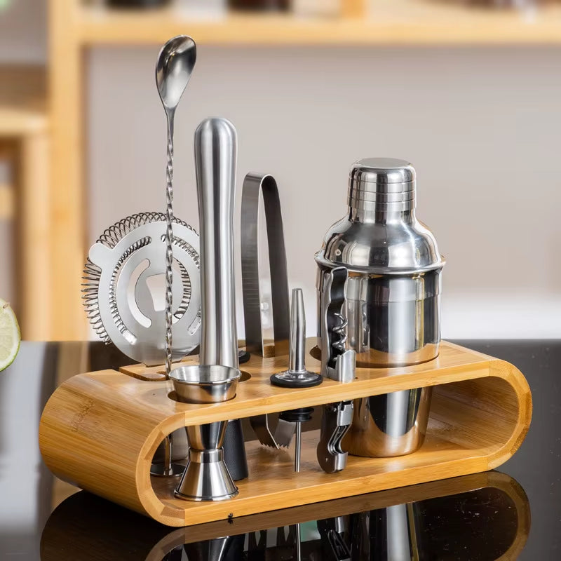 Stainless steel bartender set with cocktail shaker and tools on display.