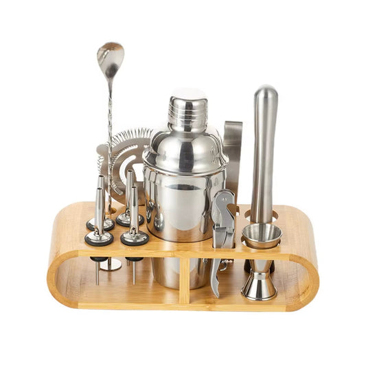 Stainless steel cocktail shaker set with bartender tools on wooden stand.