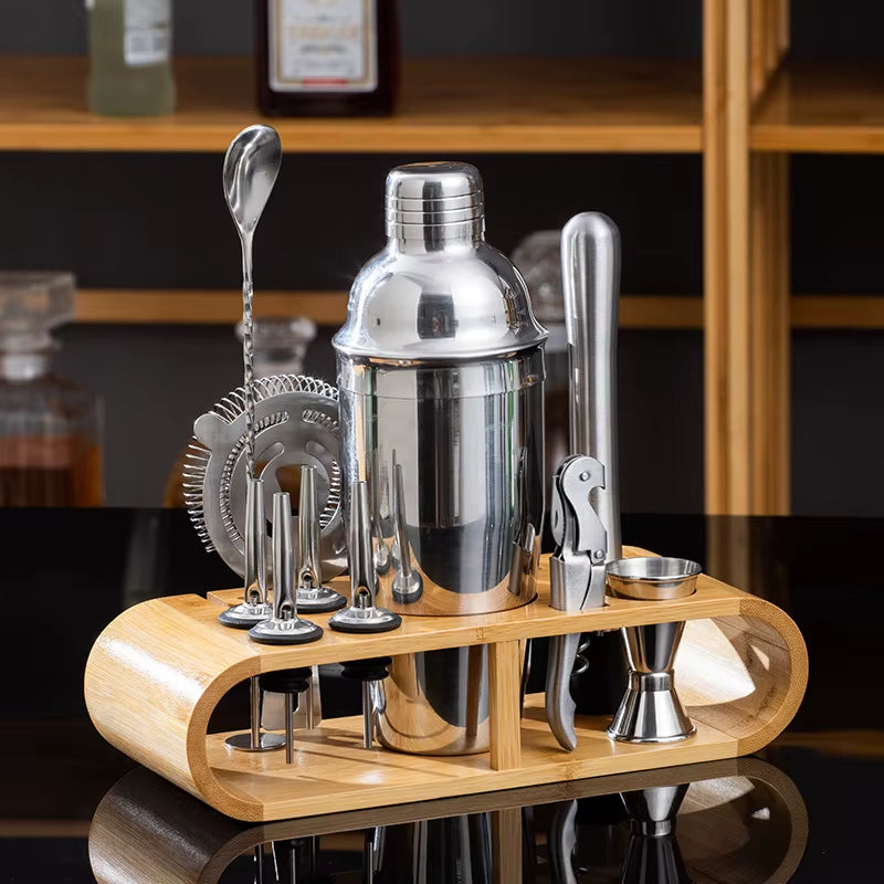 Stainless steel cocktail shaker set with bartending tools.