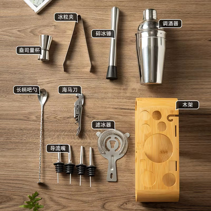 Stainless steel cocktail shaker set with wooden stand and various bartending tools.